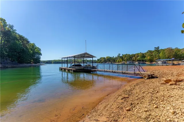 a view of a lake with houses in the background
