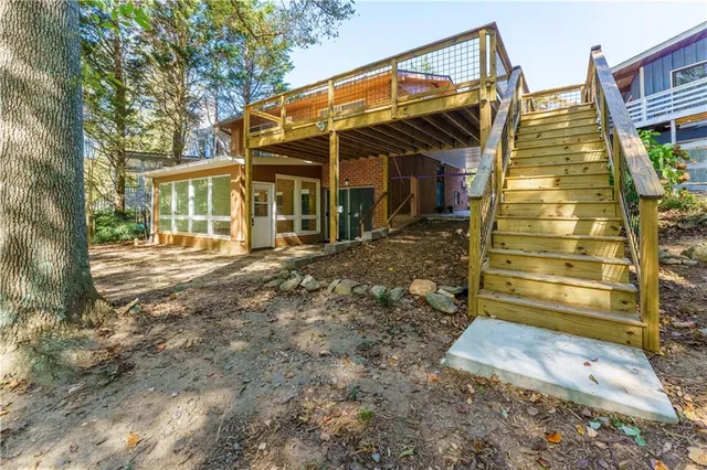 a view of outdoor space with deck and tree
