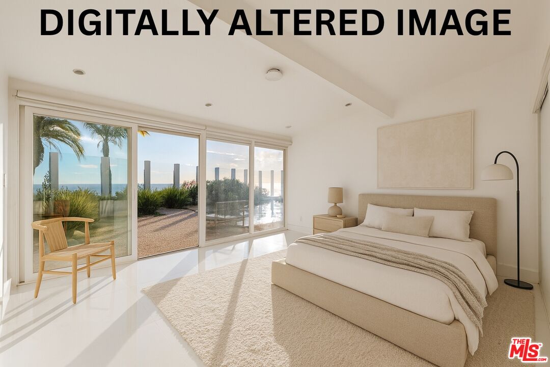 6246 Trancas Canyon Road Malibu, CA 90265 - Photo 11 of 23 a bedroom with a bed and glass door