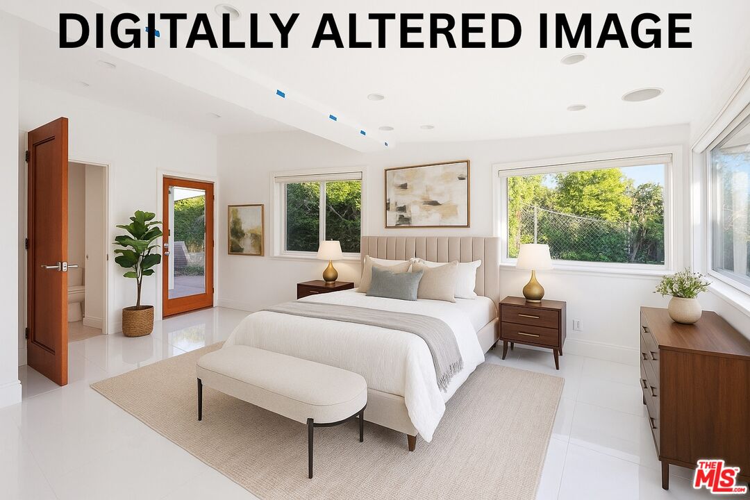 6246 Trancas Canyon Road Malibu, CA 90265 - Photo 14 of 23 a bedroom with a bed and a large window
