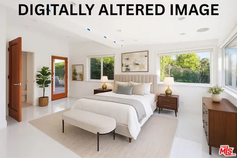 a view of a hallway with wooden floor and closet