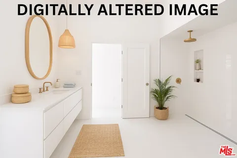 a view of a refrigerator in kitchen and an empty room
