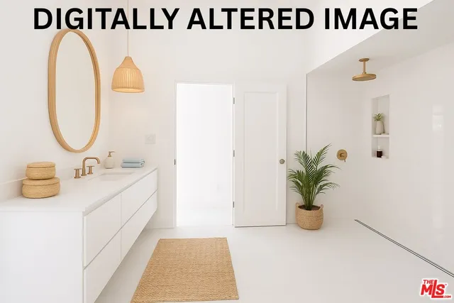 a view of a refrigerator in kitchen and an empty room