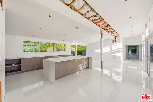 a view of a livingroom with a hall and wooden floor
