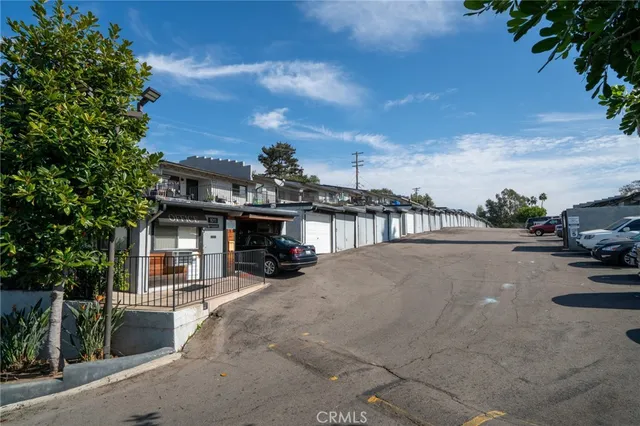 a view of a street with a car parked in front of it