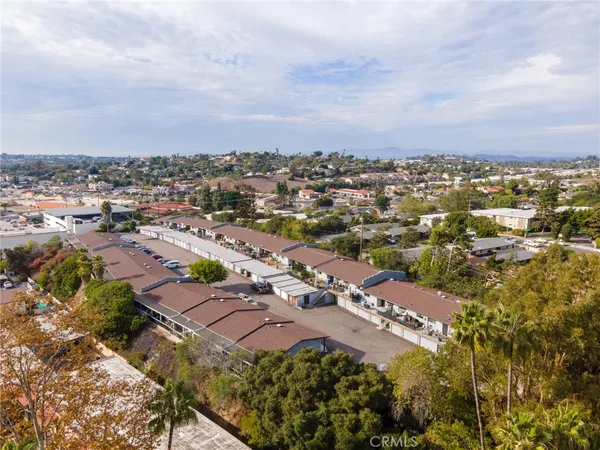 an aerial view of a city with lots of residential buildings