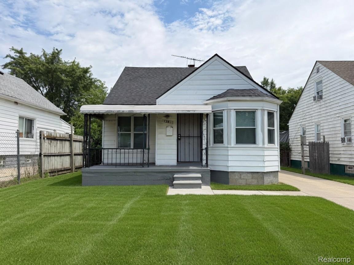 7286 Faust Avenue Detroit, MI 48228 - Photo 6 of 19 White siding exterior with a dark shingle roof
