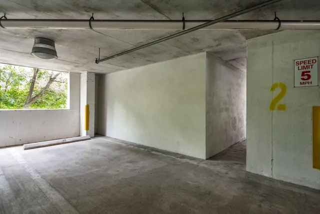 a house with lots of trees in front of it