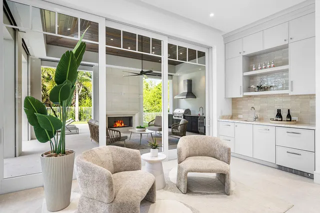 a front view of a house with swimming pool and porch