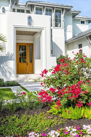 a front view of house and yard and entertaining space