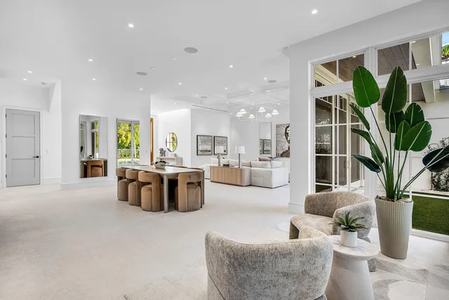 a bedroom with a large bed and a large window