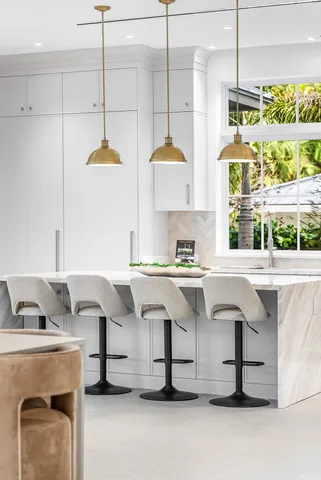 a spacious bathroom with a tub sink and mirror