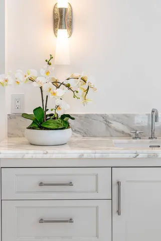 an aerial view of residential house with outdoor space and trees all around