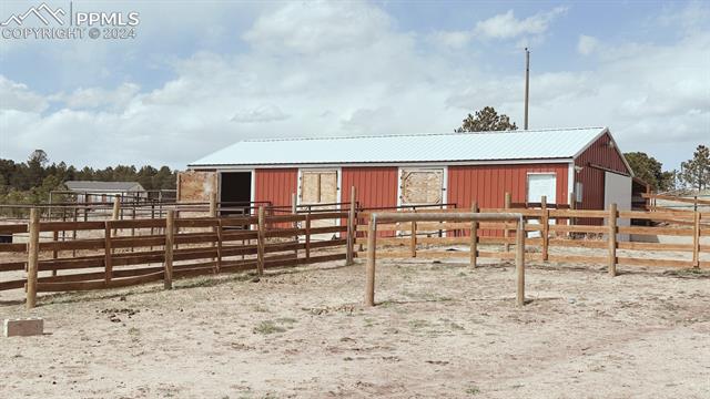 8250 Poco Road Colorado Springs, CO 80908 - Photo 13 of 14 View of stable with an outdoor structure