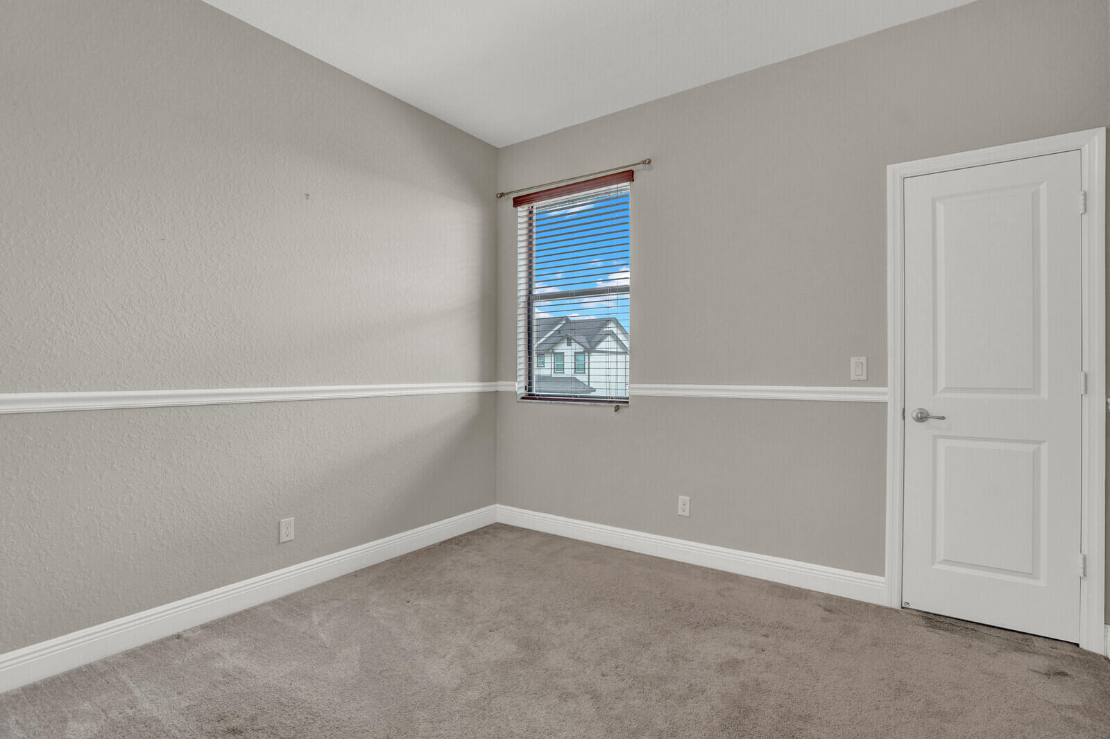 19739 Wheelbarrow Bend Loxahatchee, FL 33470 - Photo 31 of 57 an empty room with windows