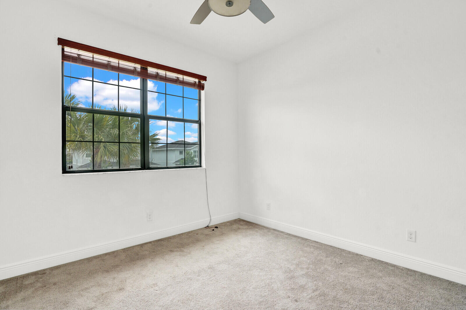 19739 Wheelbarrow Bend Loxahatchee, FL 33470 - Photo 35 of 57 a view of an empty room with a window