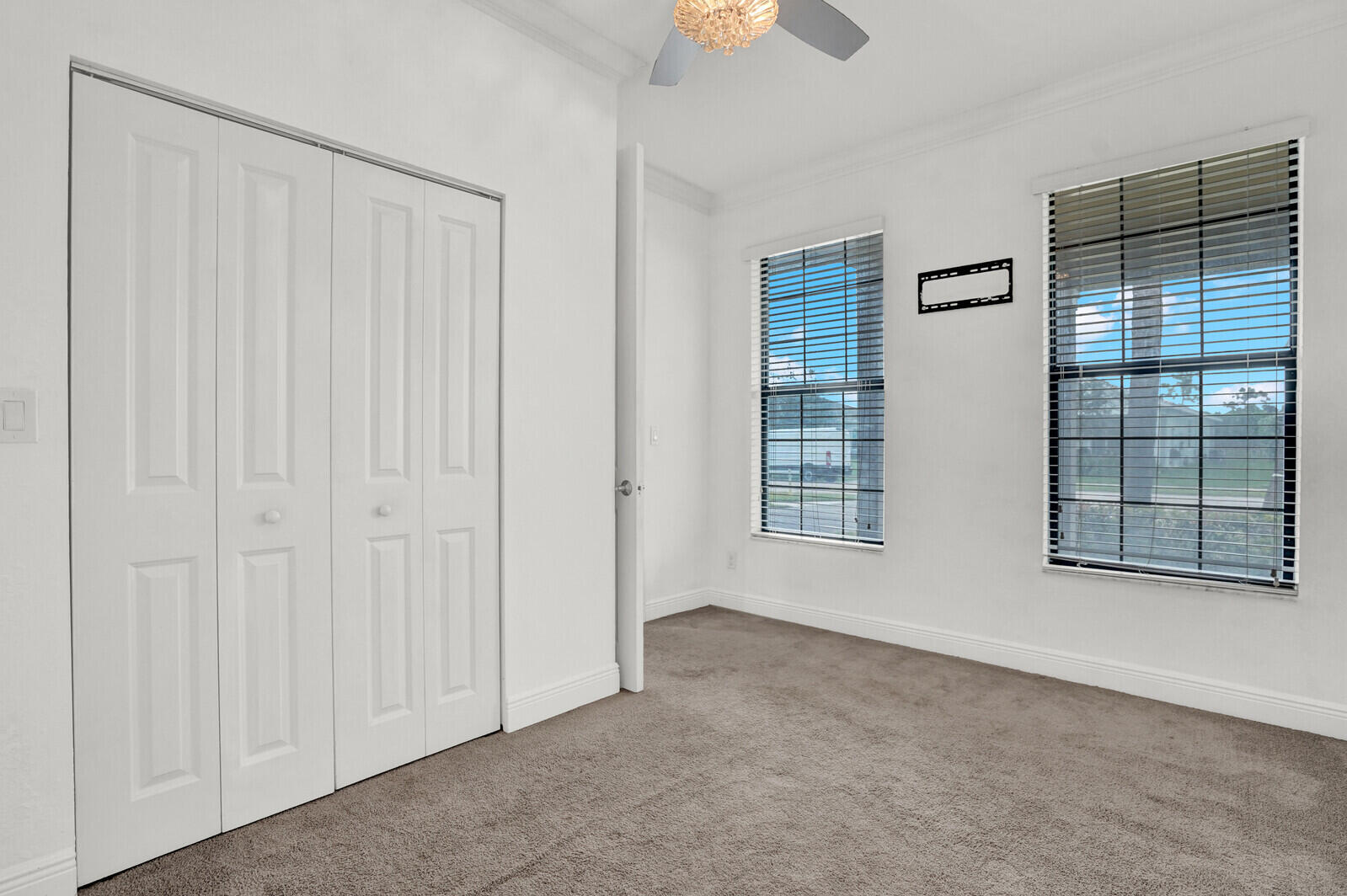 19739 Wheelbarrow Bend Loxahatchee, FL 33470 - Photo 38 of 57 an empty room with windows
