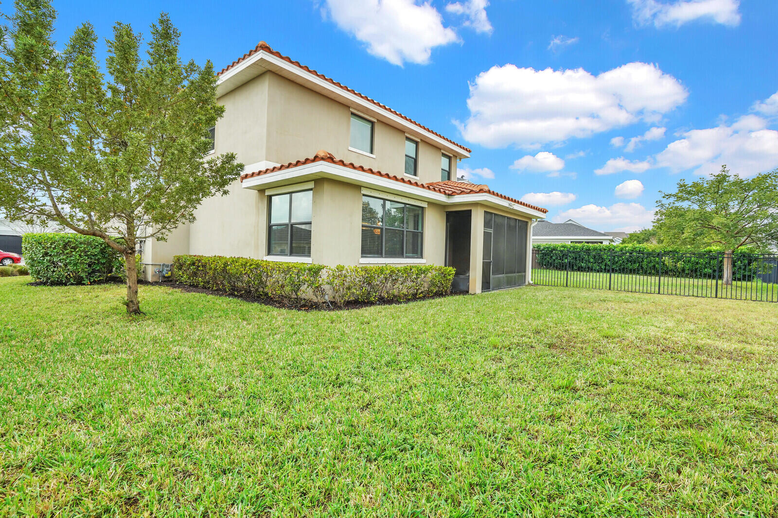 19739 Wheelbarrow Bend Loxahatchee, FL 33470 - Photo 45 of 57 a view of a house with a backyard