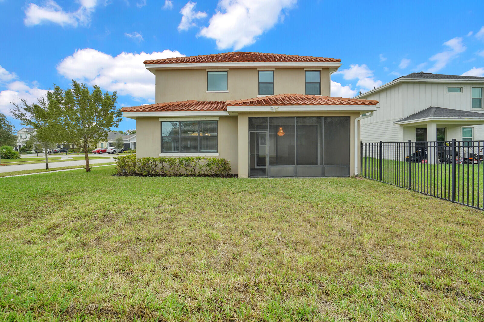 19739 Wheelbarrow Bend Loxahatchee, FL 33470 - Photo 46 of 57 a view of a yard in front of a house