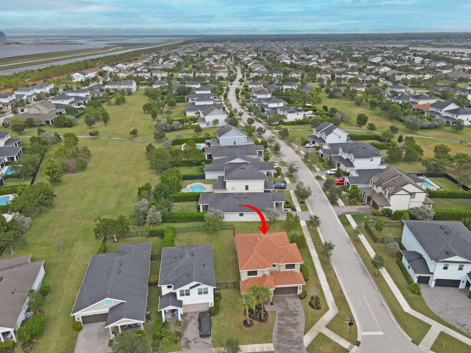 19739 Wheelbarrow Bend Loxahatchee, FL 33470 - Photo 55 of 57 an aerial view of residential houses with outdoor space