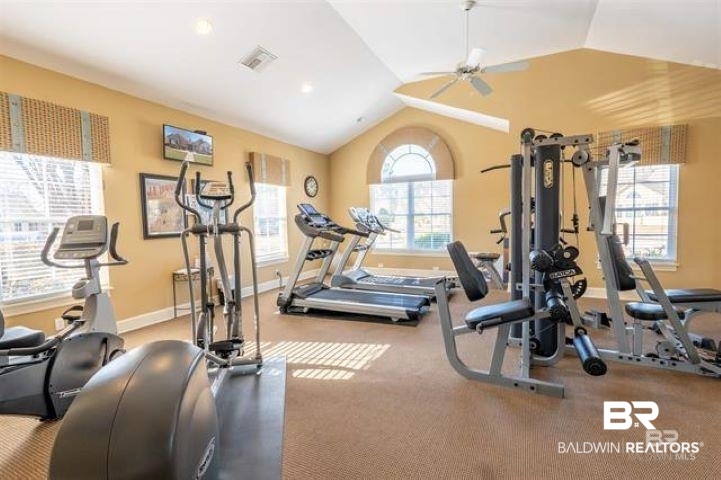 301 Holmes Avenue, Unit 301 Foley, AL 36535 - Photo 44 of 54 Gym with visible vents, ceiling fan, baseboards, and lofted ceiling
