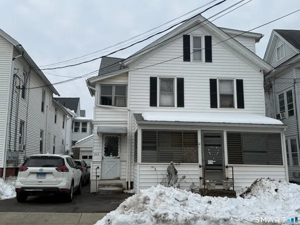 a view of a car park in front of house