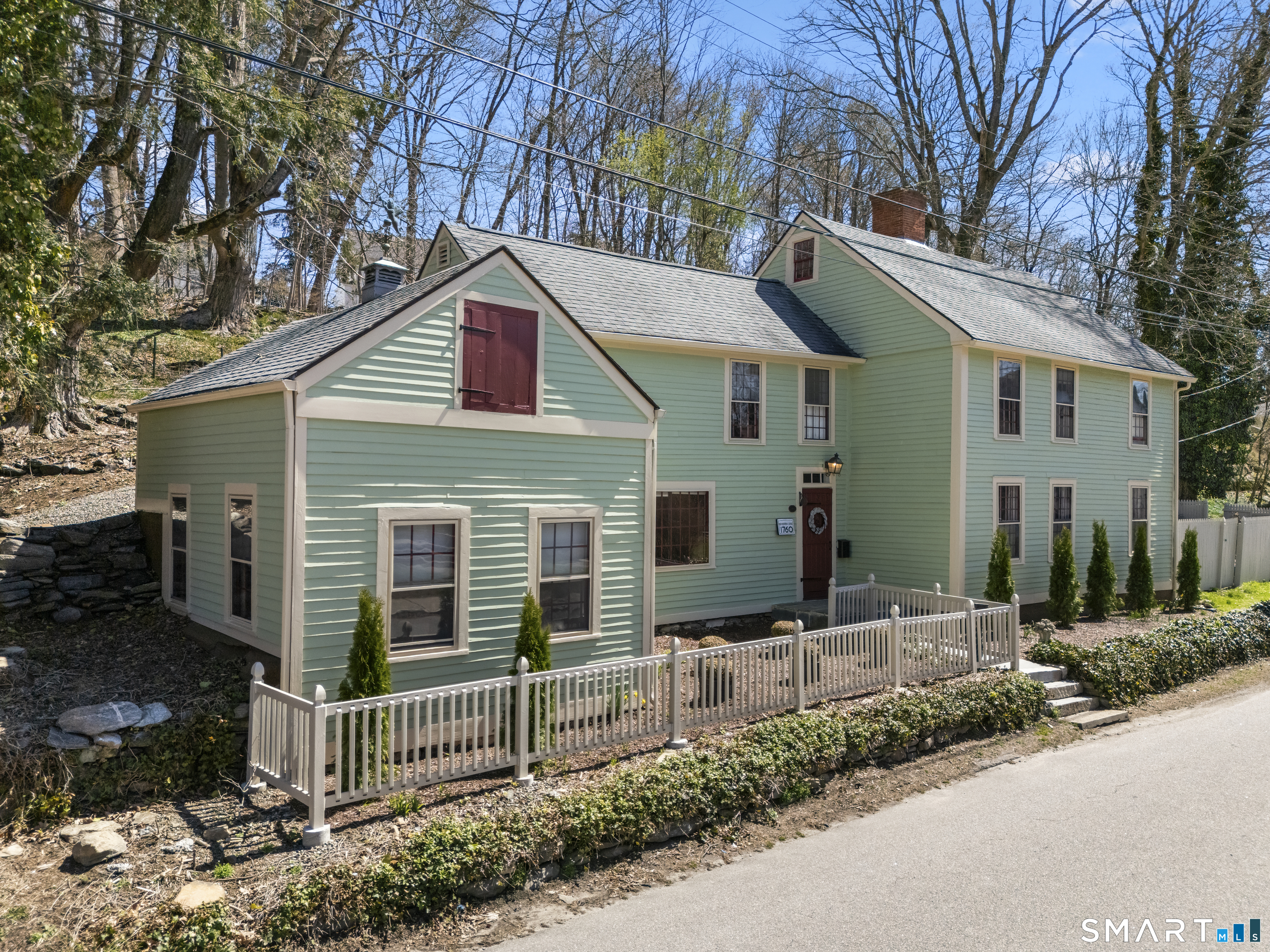 371 Washington Street Norwich, CT 06360 - Photo 1 of 38 a front view of house with yard and green space