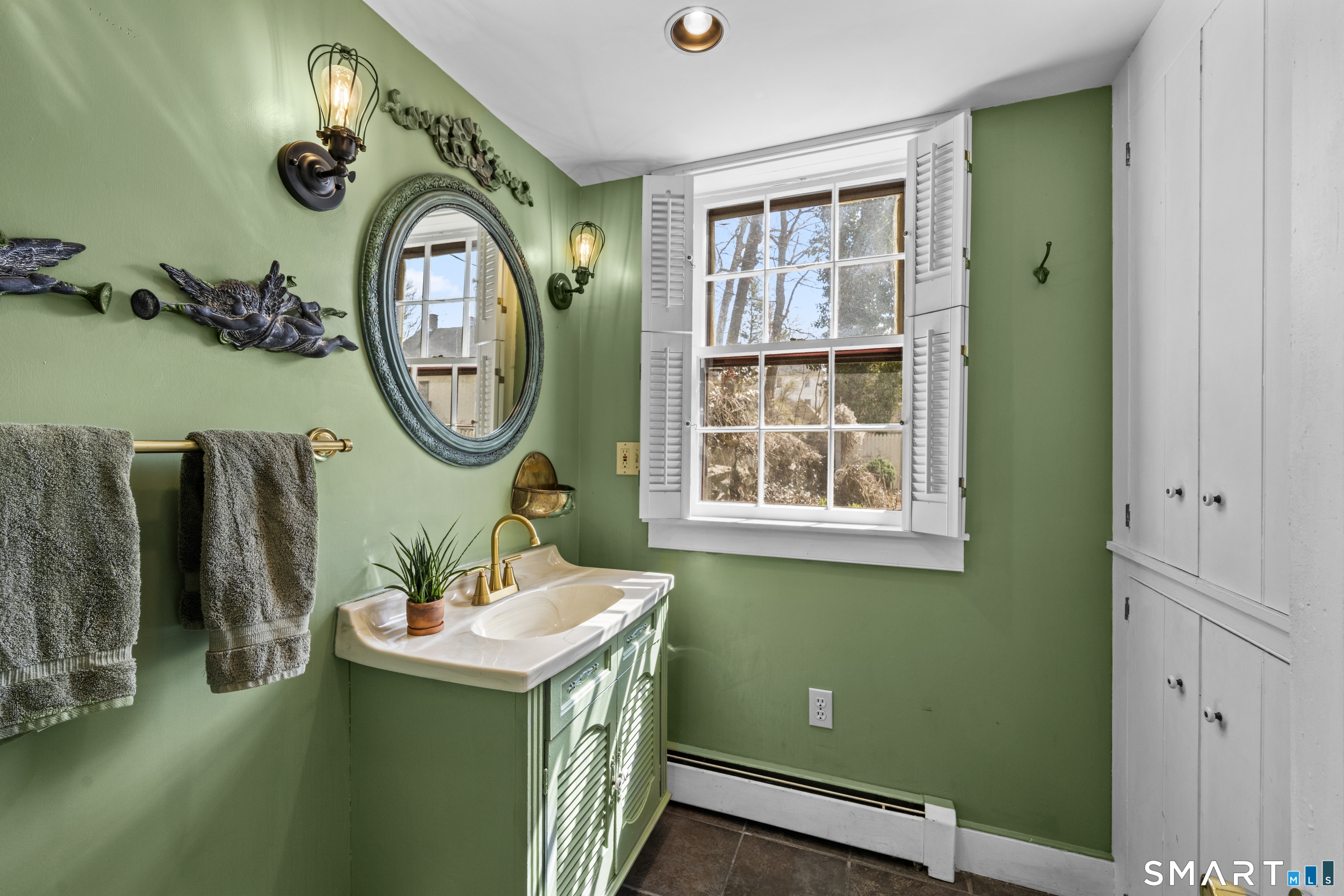 371 Washington Street Norwich, CT 06360 - Photo 13 of 38 a bathroom with a sink and a mirror