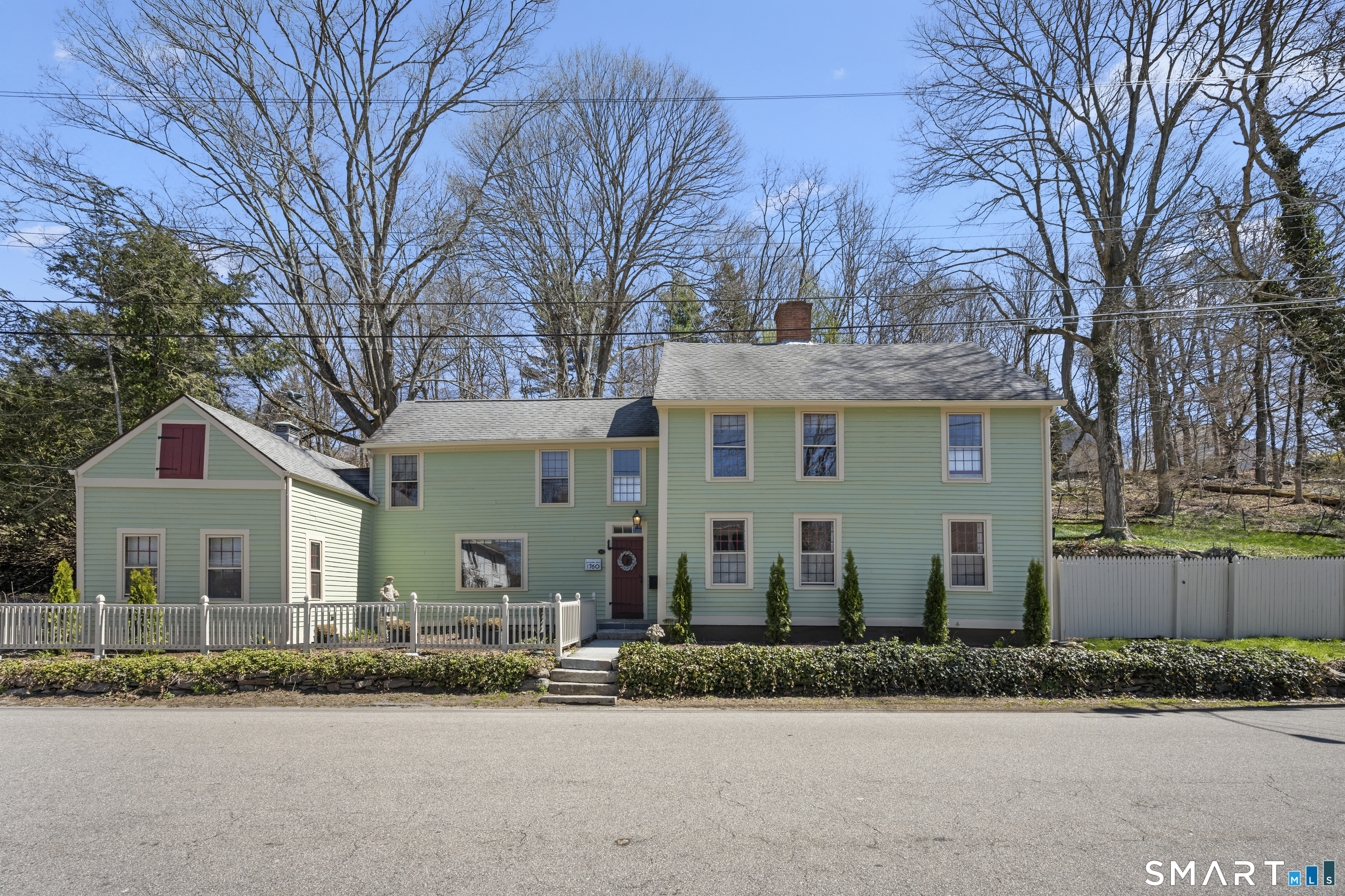 371 Washington Street Norwich, CT 06360 - Photo 18 of 38 front view of a house with a street