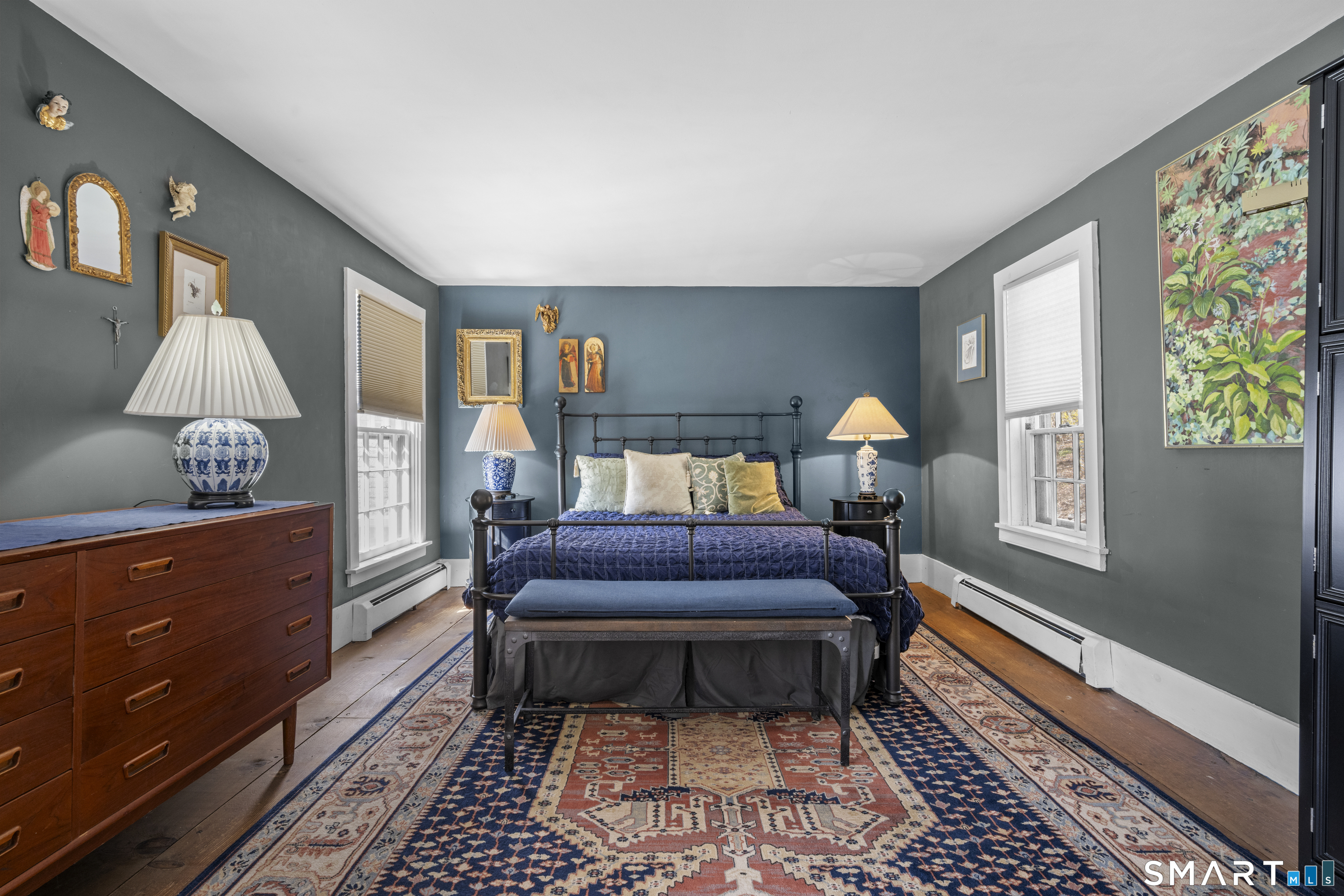 371 Washington Street Norwich, CT 06360 - Photo 20 of 38 a bedroom with a bed and wooden floor