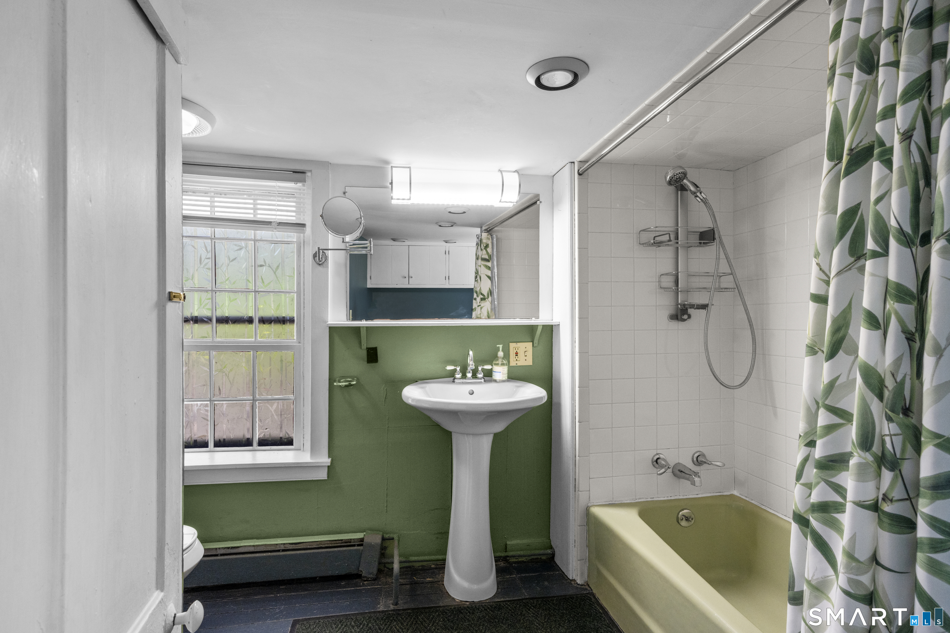 371 Washington Street Norwich, CT 06360 - Photo 25 of 38 a bathroom with a sink a bathtub and a shower