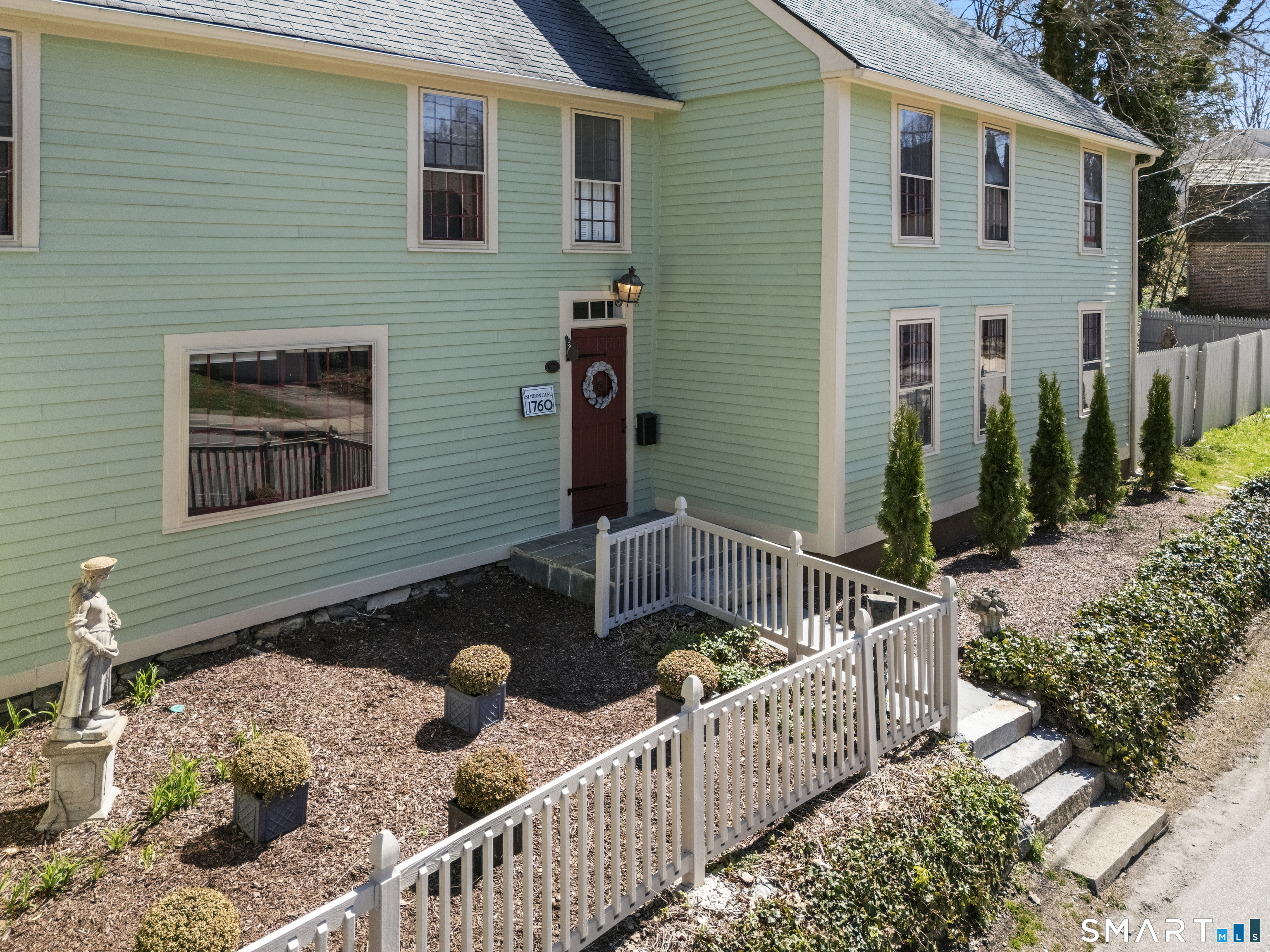 371 Washington Street Norwich, CT 06360 - Photo 36 of 38 a front view of a house with two chairs