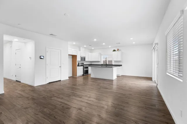 a view of kitchen with wooden floor