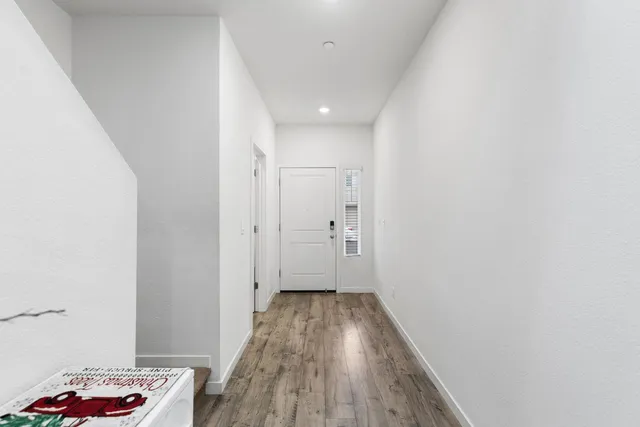 a view of room with wooden floor