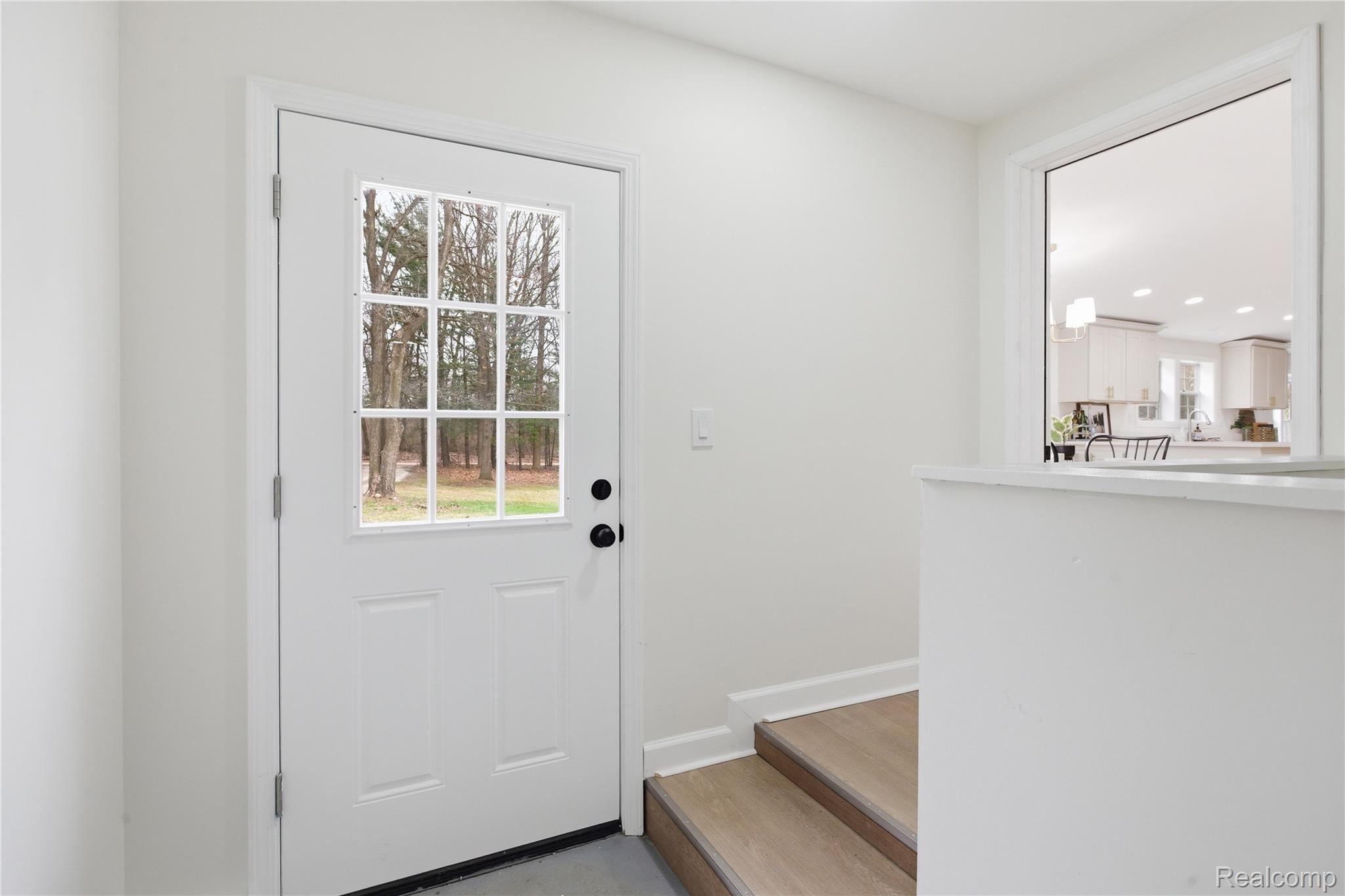 5350 List Road Grass Lake, MI 49240 - Photo 36 of 71 Doorway to outside featuring baseboards