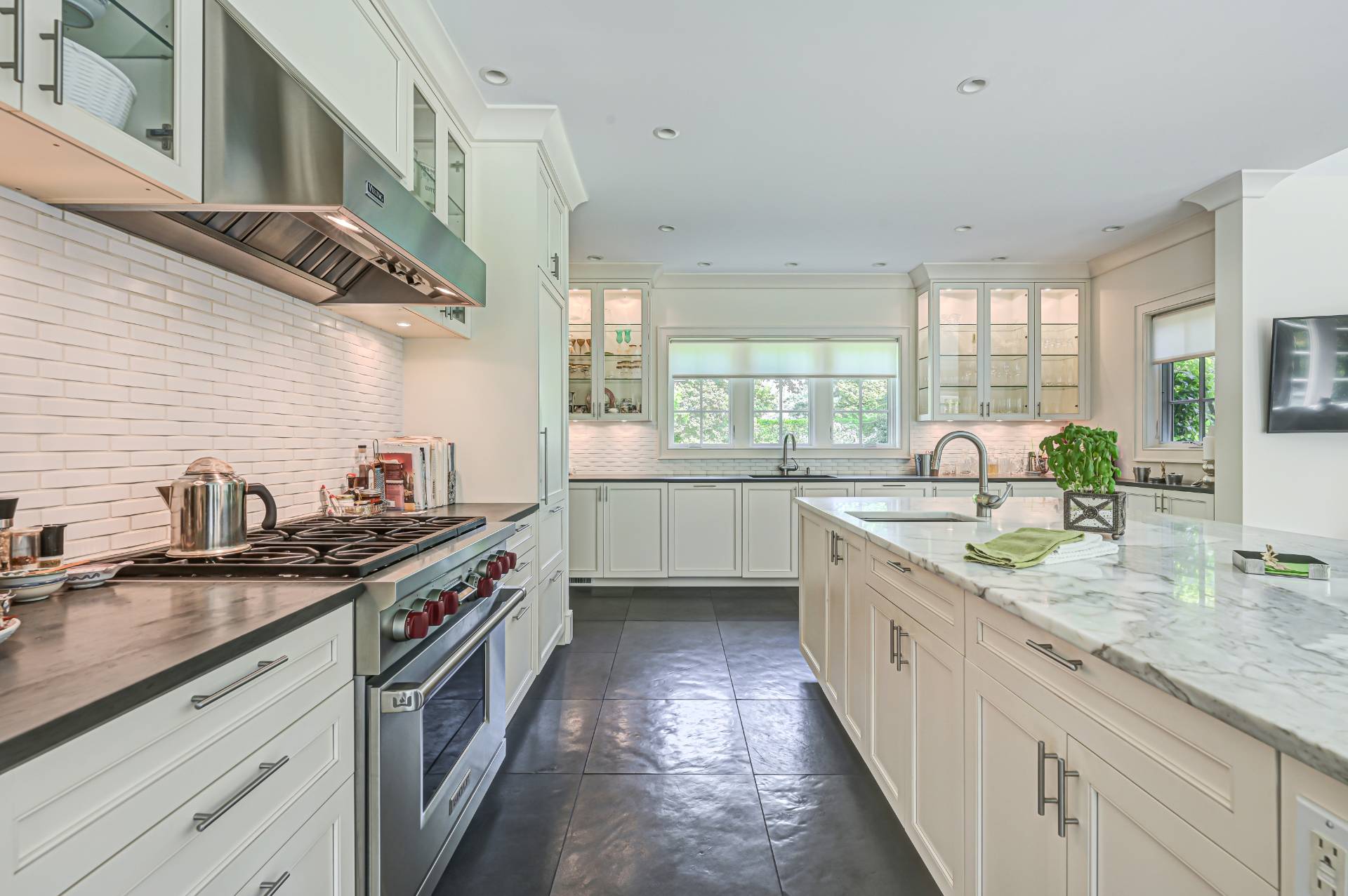 Undisclosed Address Remsenburg, NY 11960 - Photo 11 of 50 a kitchen with stainless steel appliances granite countertop a sink a stove and a wooden floors