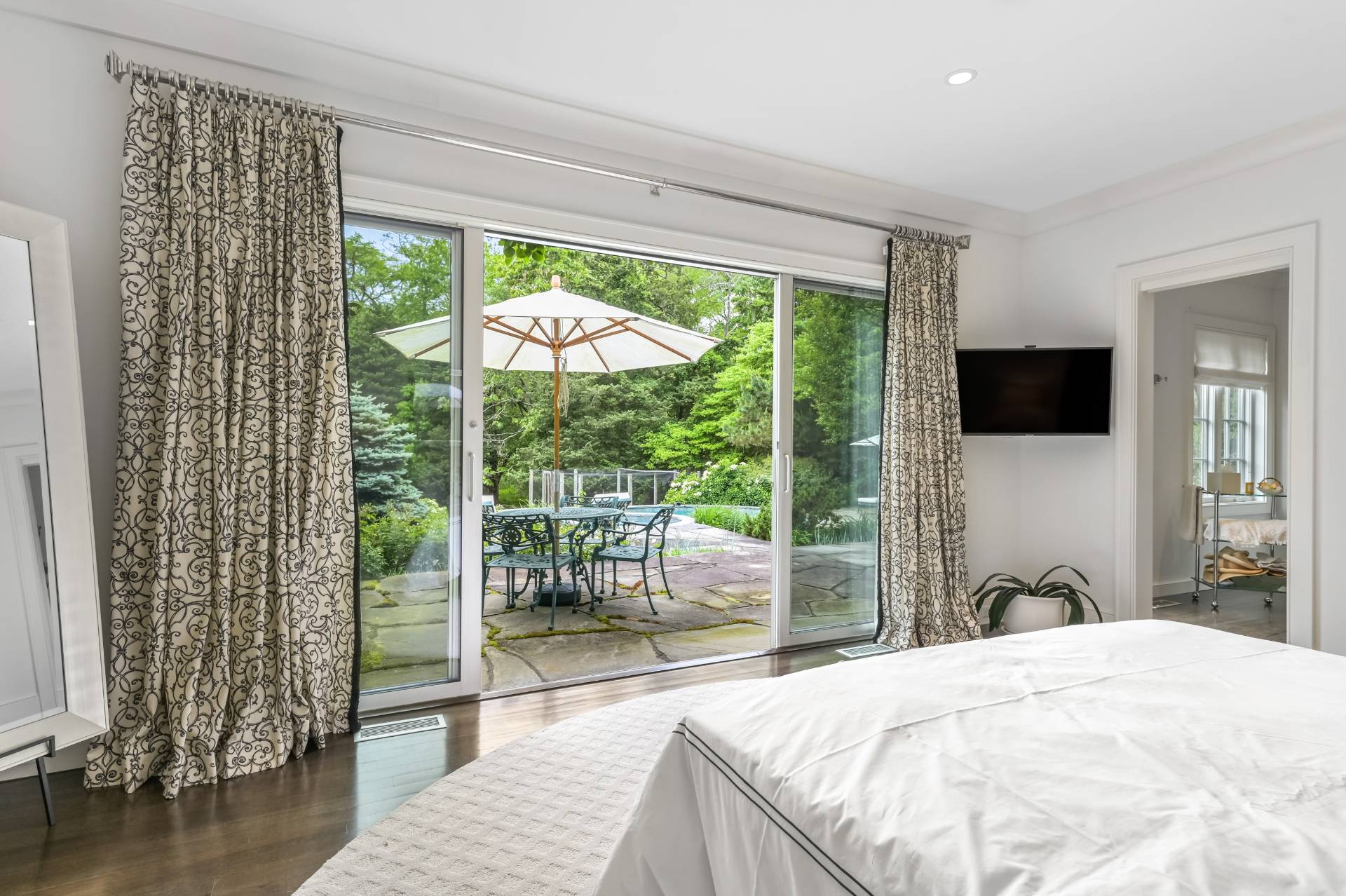 Undisclosed Address Remsenburg, NY 11960 - Photo 17 of 50 a bedroom with a bed and large window