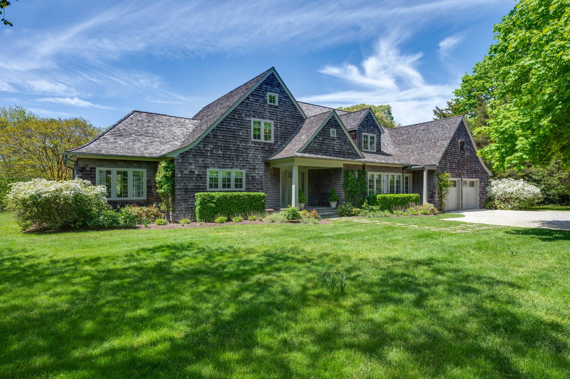 Undisclosed Address Remsenburg, NY 11960 - Photo 30 of 50 a front view of a house with a yard