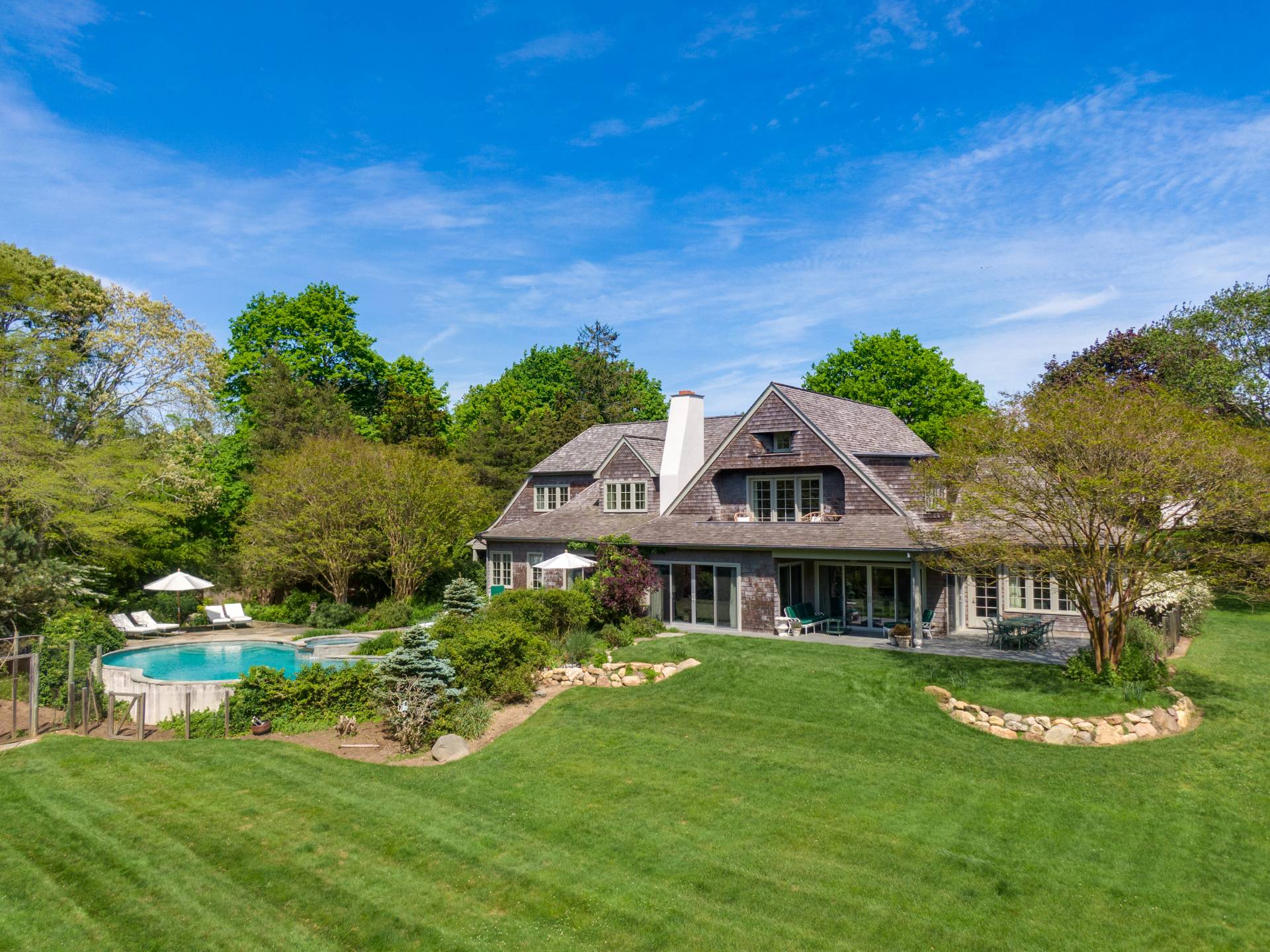 Undisclosed Address Remsenburg, NY 11960 - Photo 31 of 50 a front view of a house with a garden