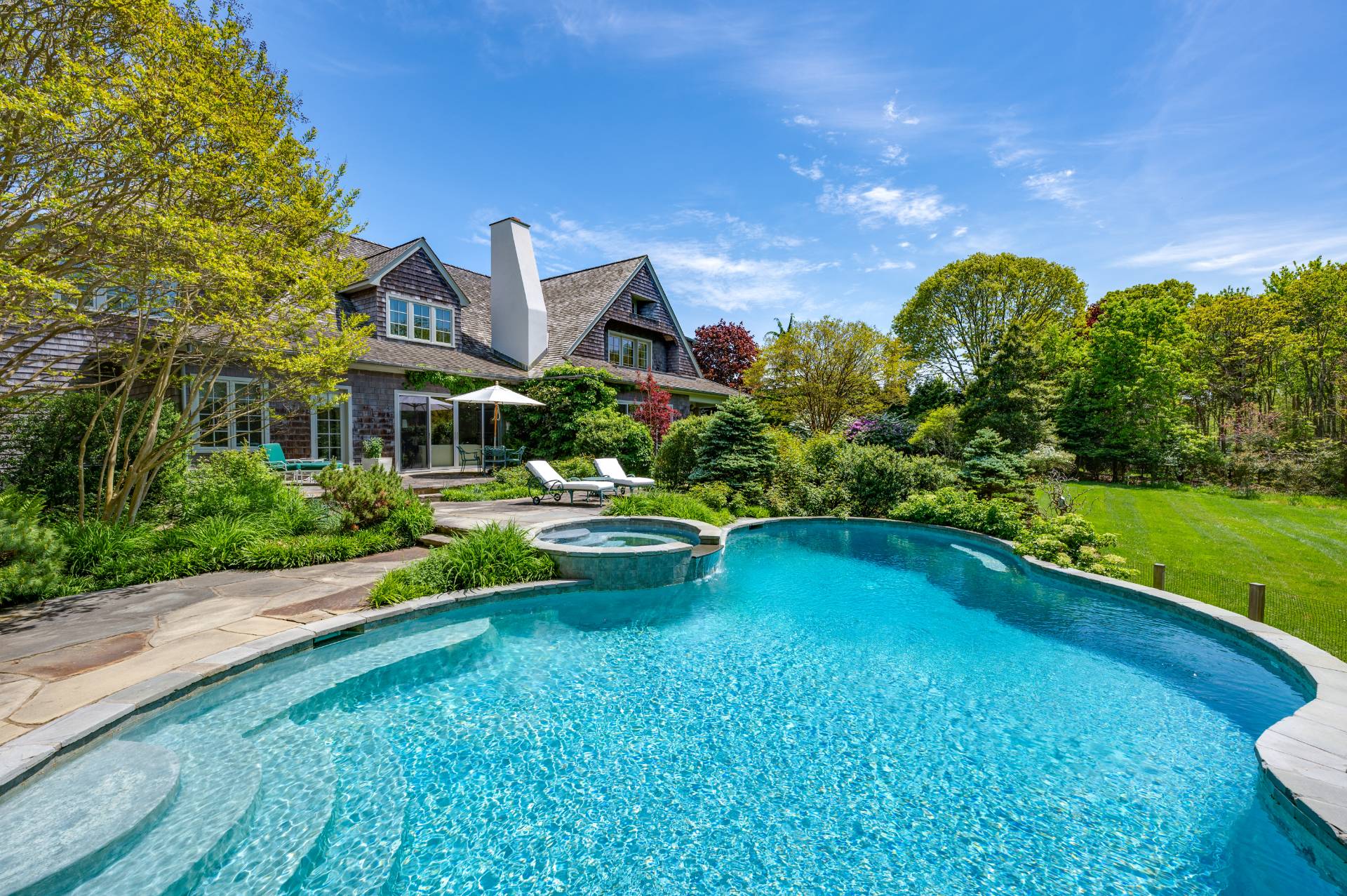 Undisclosed Address Remsenburg, NY 11960 - Photo 32 of 50 a swimming pool with outdoor seating and yard