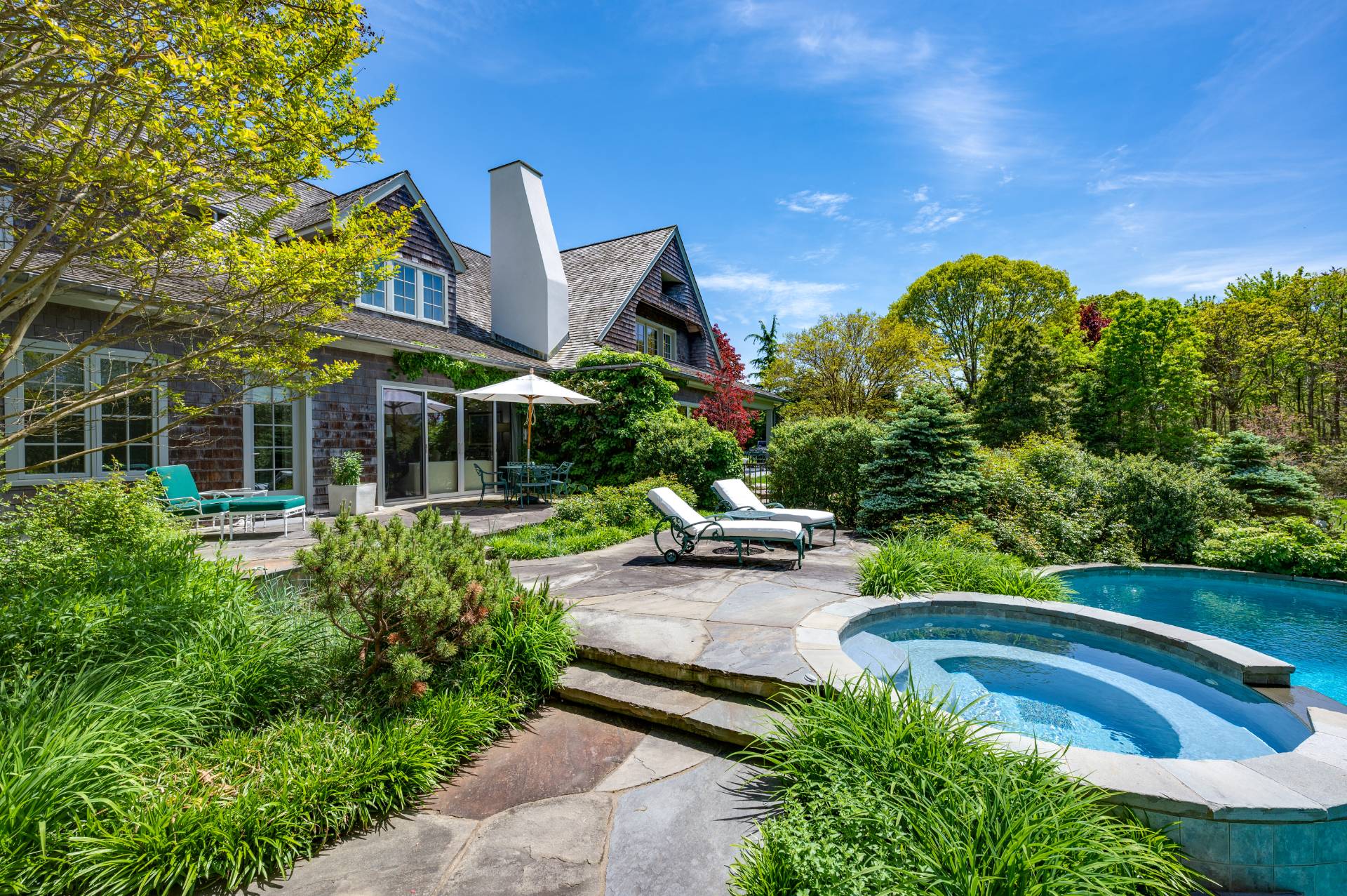 Undisclosed Address Remsenburg, NY 11960 - Photo 33 of 50 a view of a house with pool and chairs