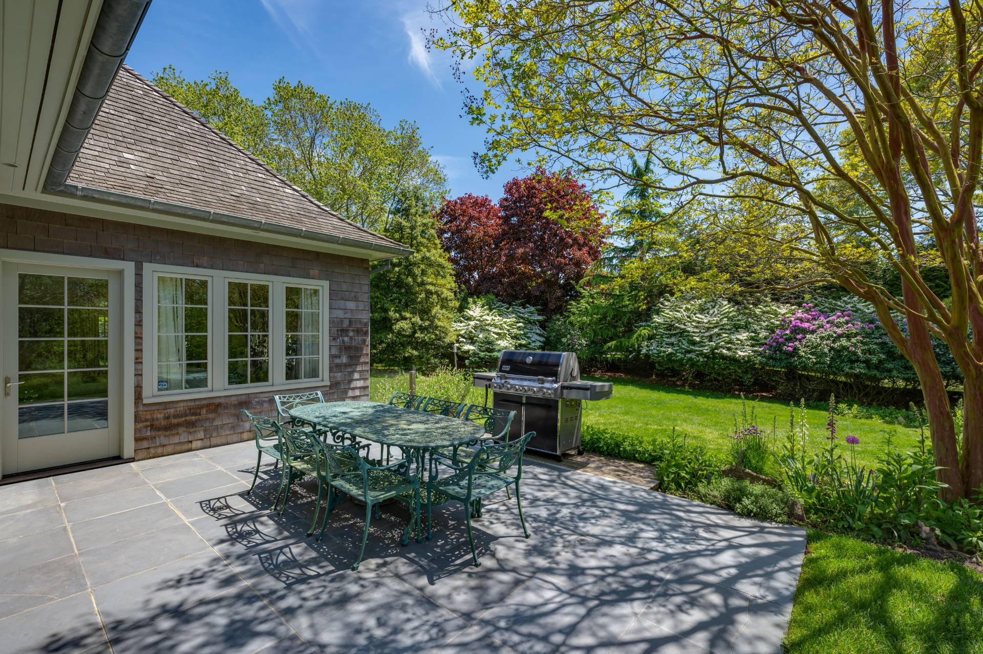 Undisclosed Address Remsenburg, NY 11960 - Photo 41 of 50 a front view of a house with garden and porch