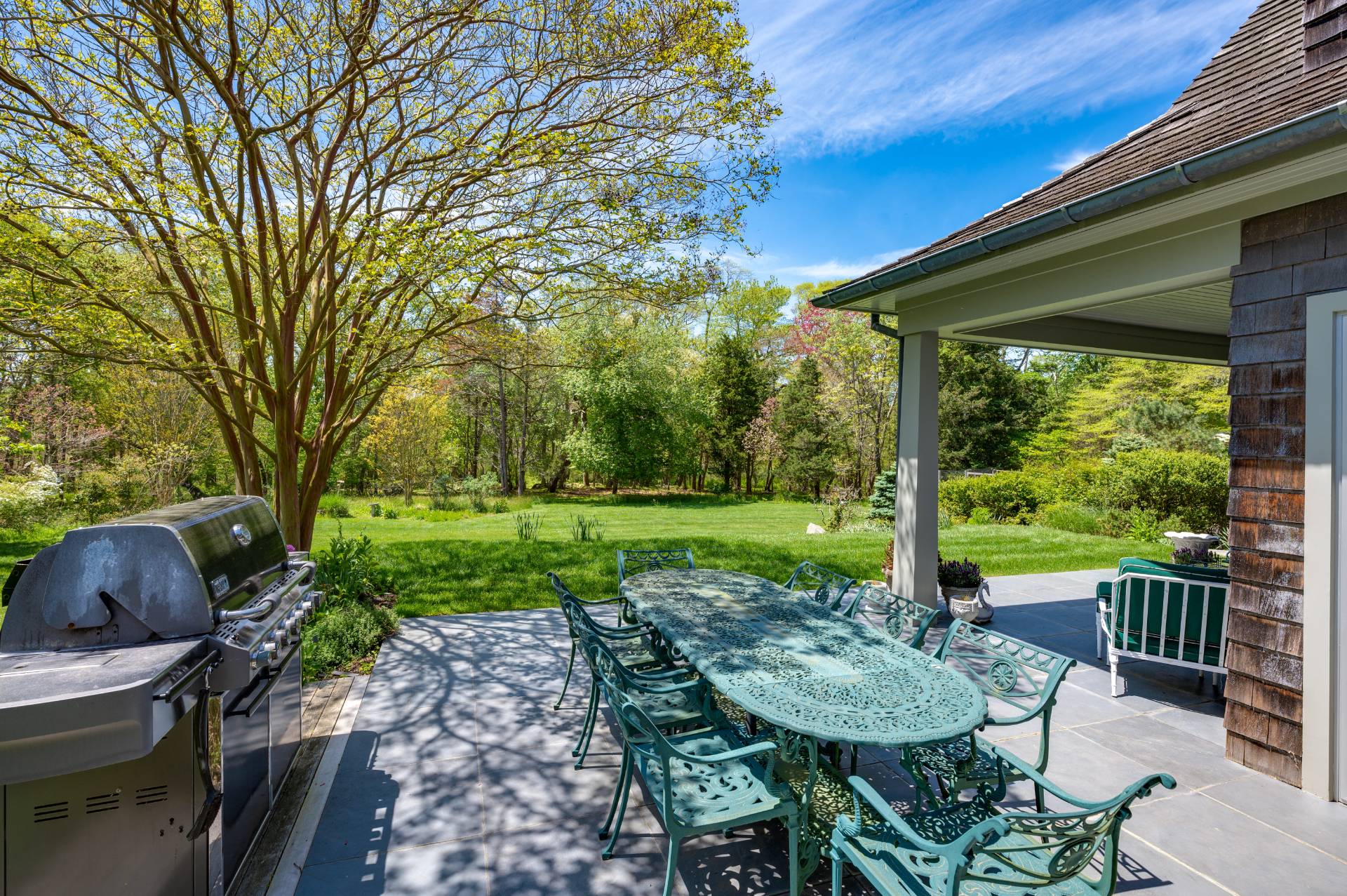 Undisclosed Address Remsenburg, NY 11960 - Photo 43 of 50 a view of a patio with a table chairs and a backyard