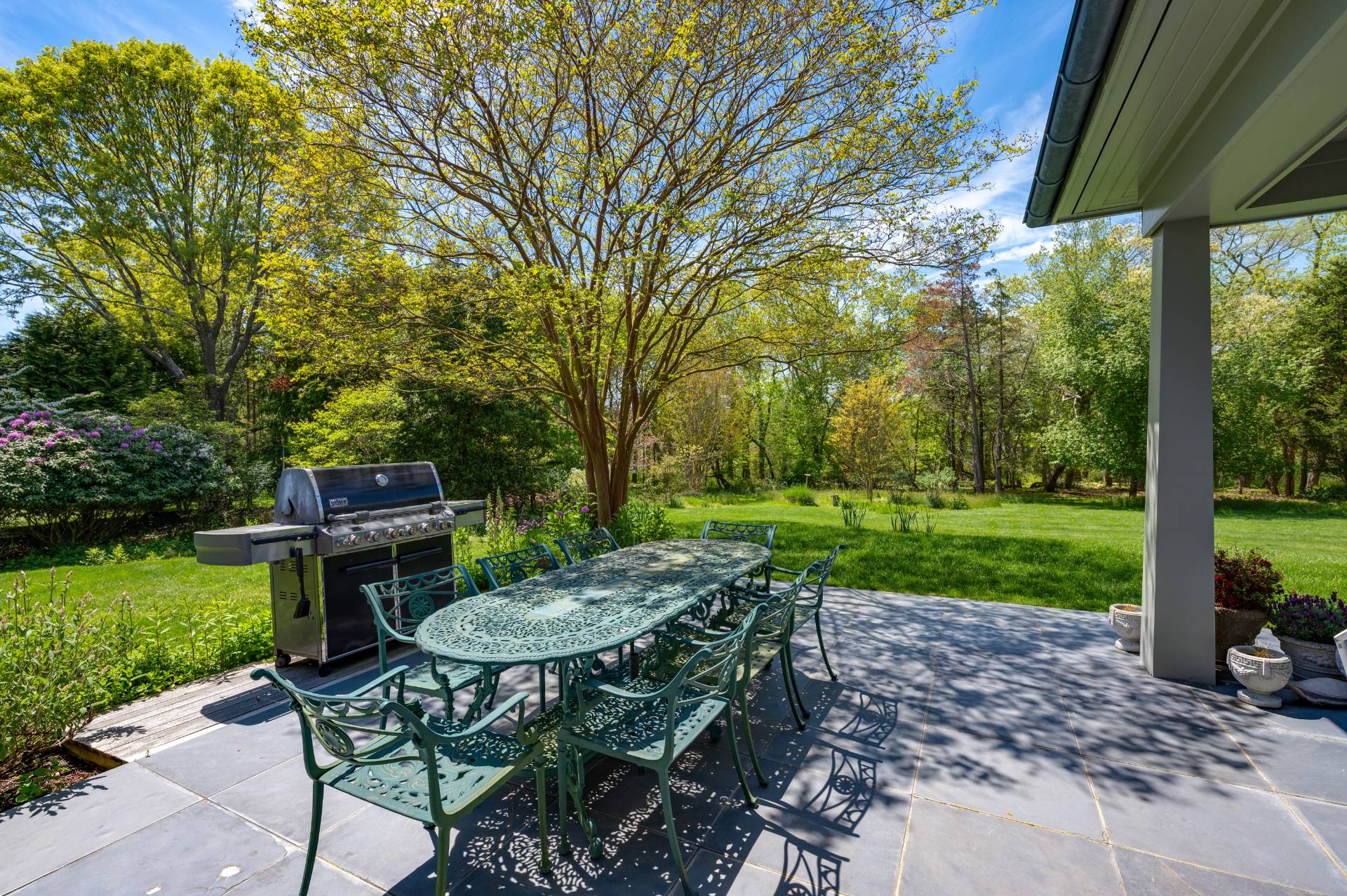 Undisclosed Address Remsenburg, NY 11960 - Photo 44 of 50 a view of a chairs and table in backyard of the house
