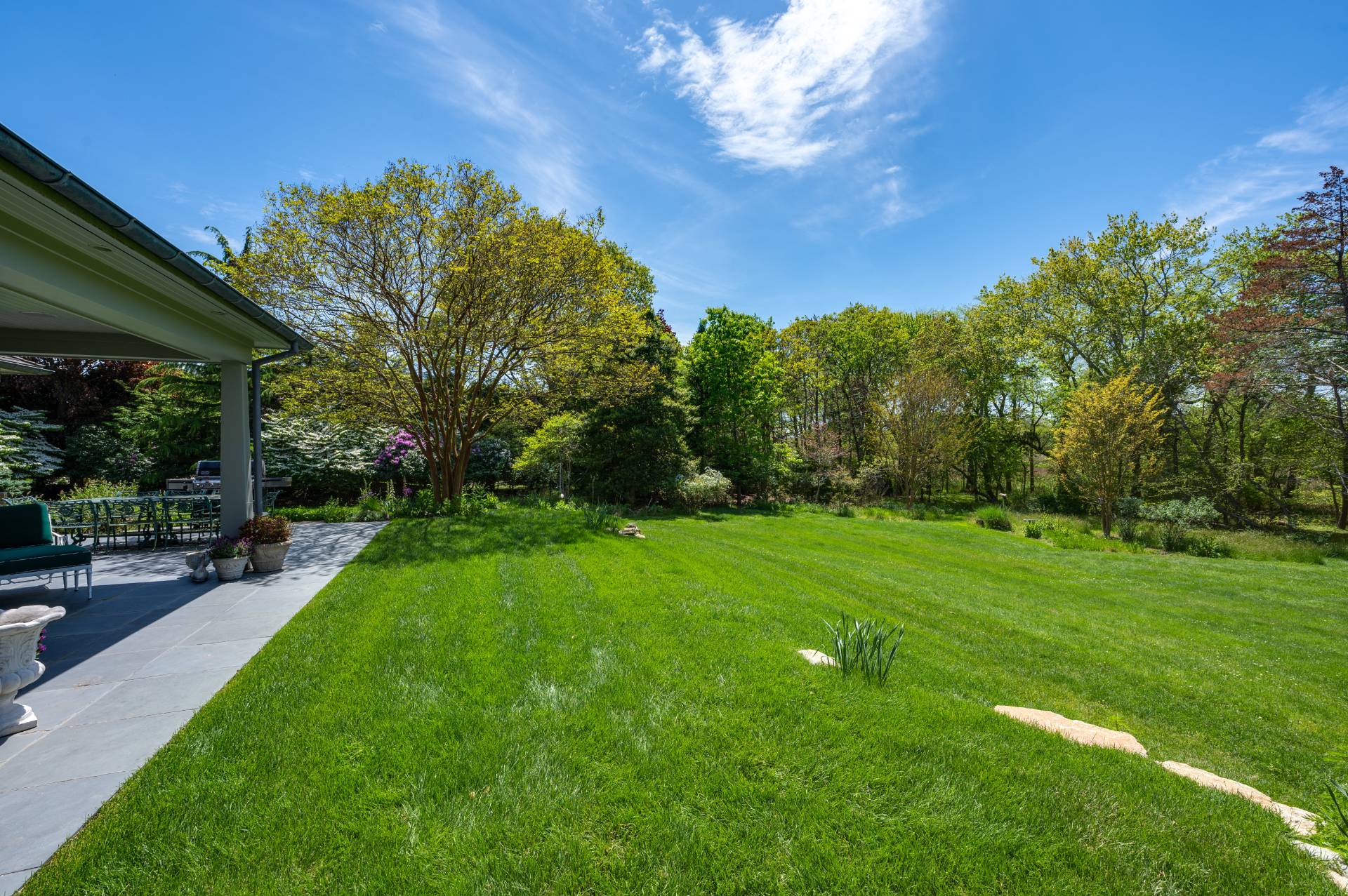 Undisclosed Address Remsenburg, NY 11960 - Photo 48 of 50 a view of a backyard with a garden