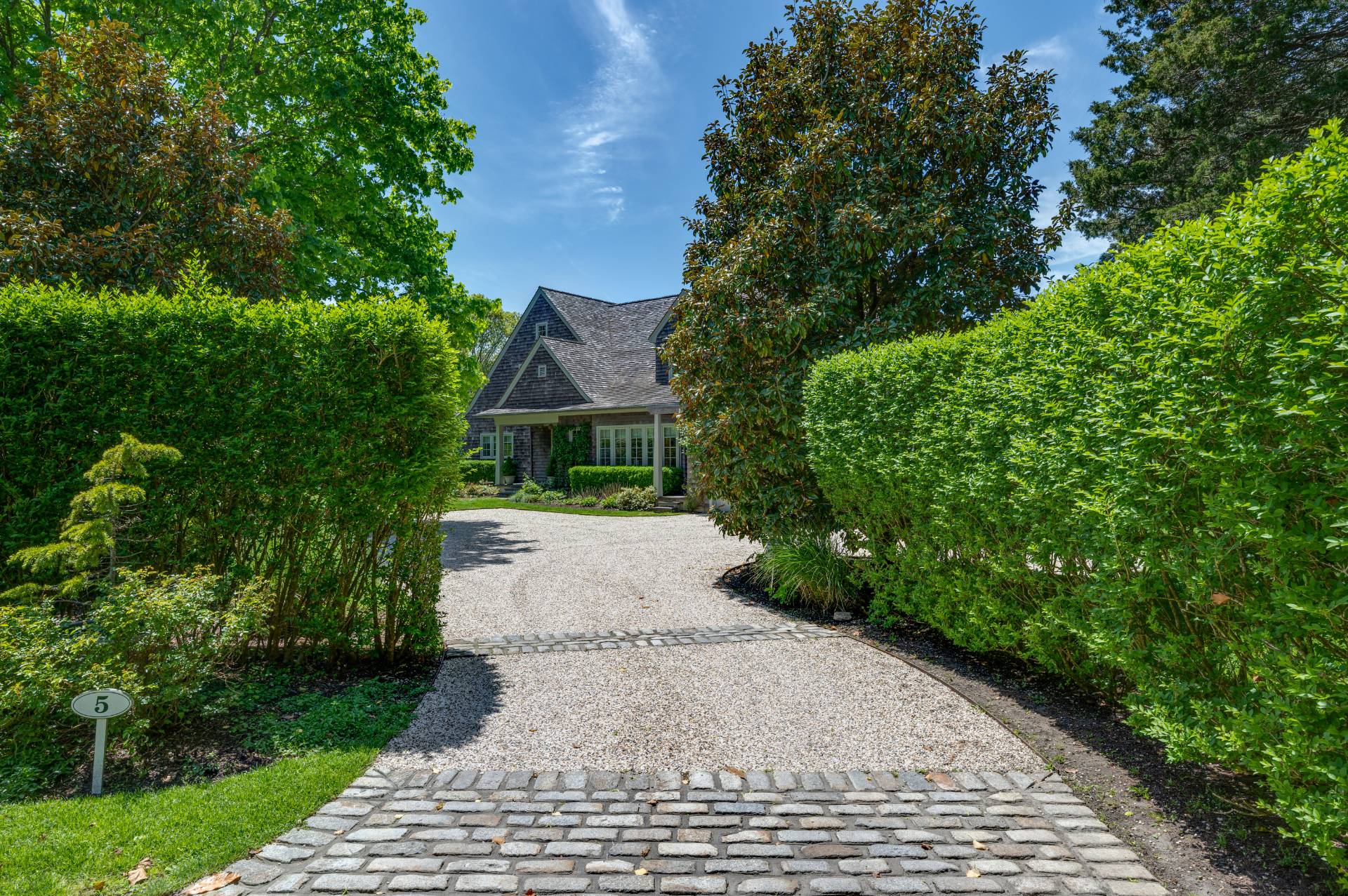 Undisclosed Address Remsenburg, NY 11960 - Photo 49 of 50 a front view of a house with a yard and trees
