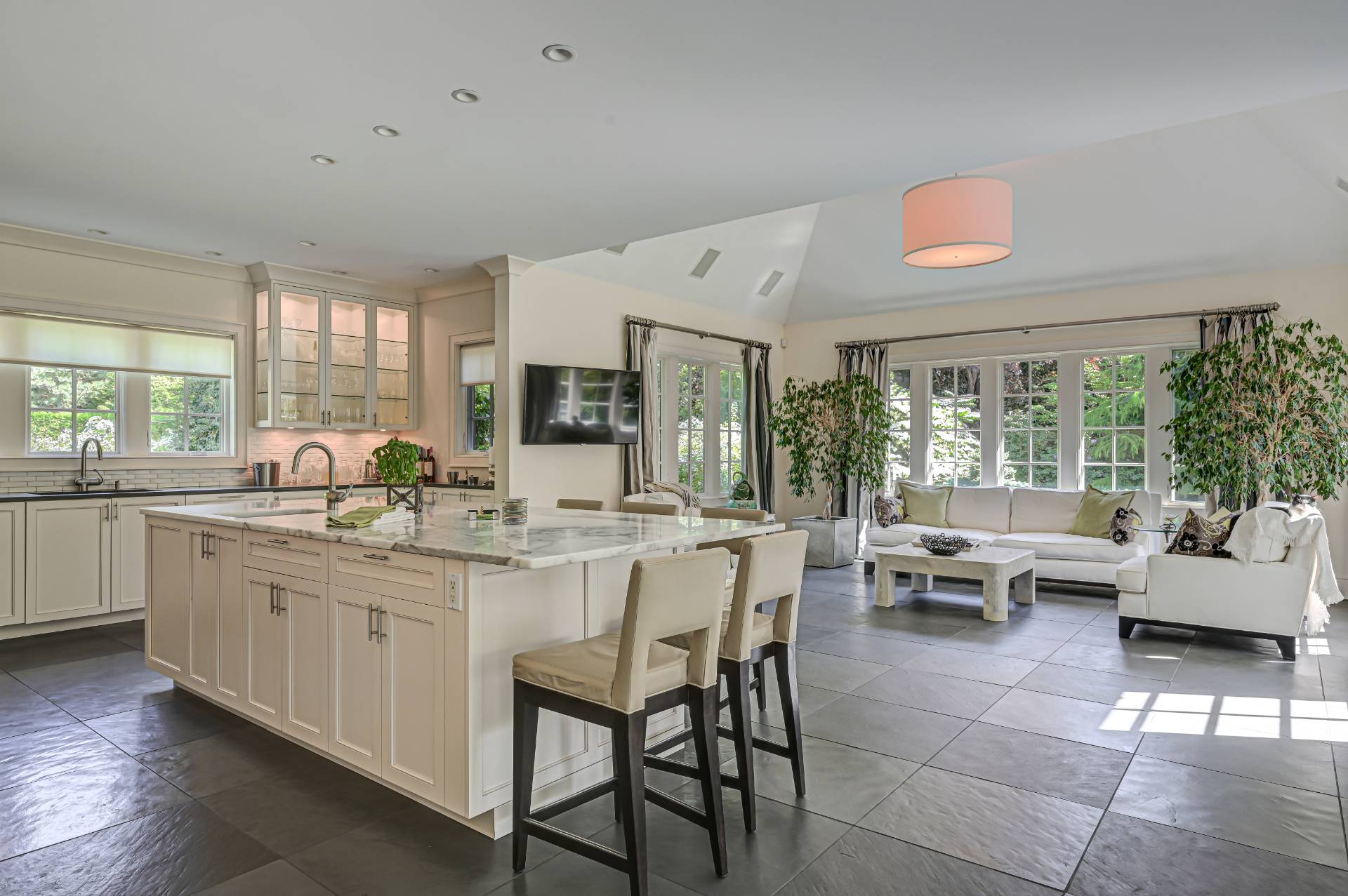 Undisclosed Address Remsenburg, NY 11960 - Photo 10 of 50 a kitchen with living room and white cabinets