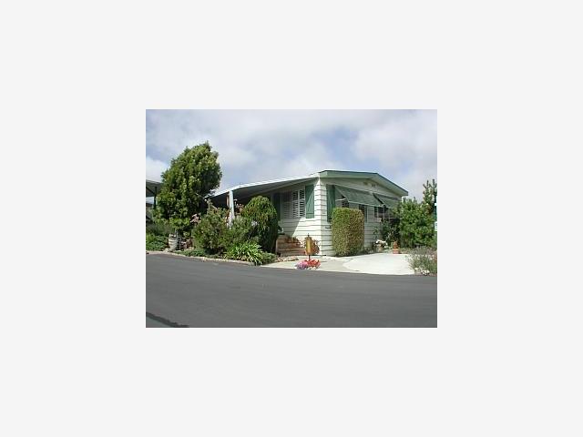 1007 Freedom, Unit 32 Watsonville, CA 95076 - Photo 1 of 1 a picture of a person on a street