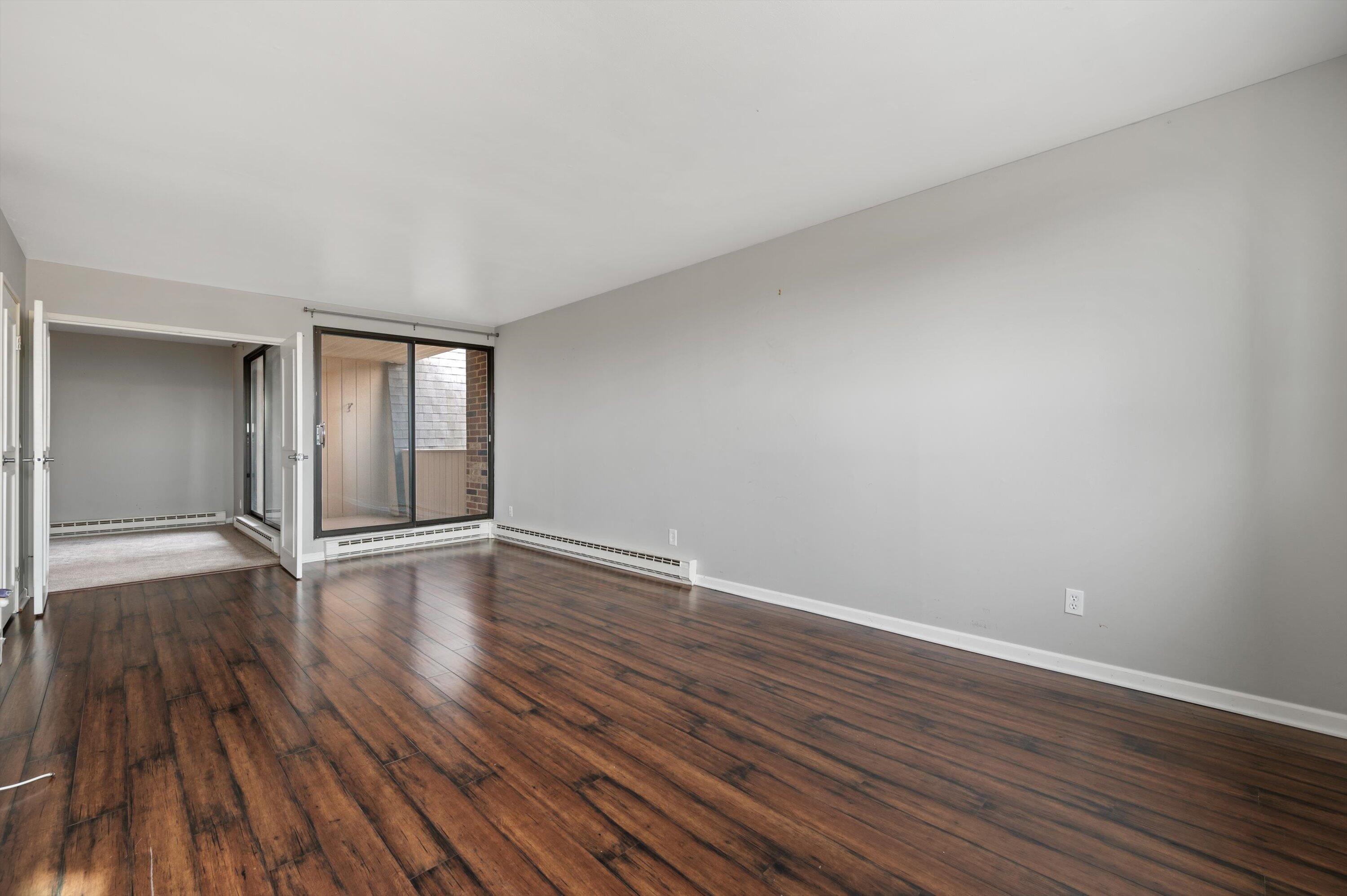 425 West Willow Court, Unit 222 Fox Point, WI 53217 - Photo 1 of 25 Primary Bedroom w/ Balcony Access