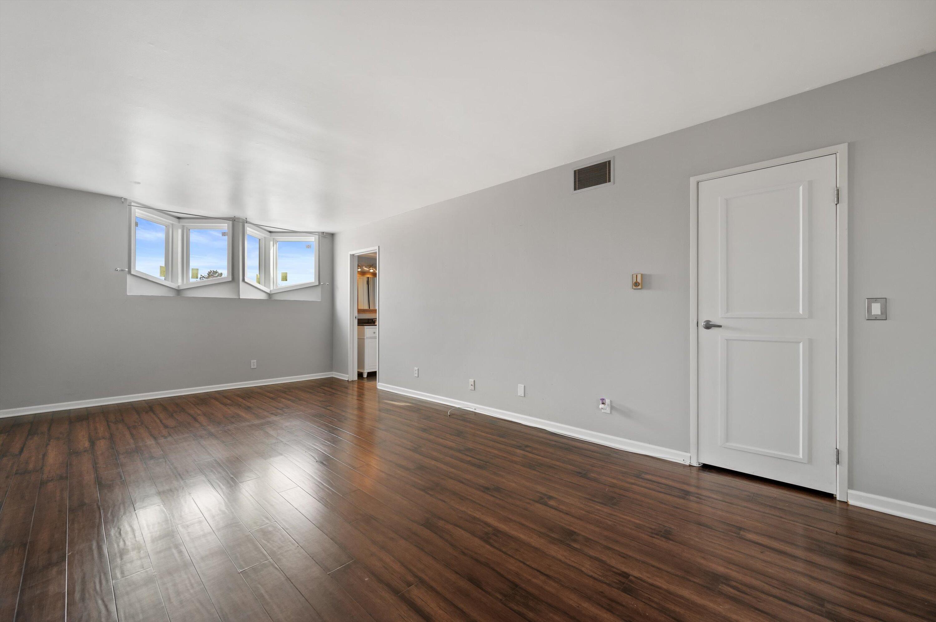 425 West Willow Court, Unit 222 Fox Point, WI 53217 - Photo 2 of 25 Primary Bedroom w/ Balcony Access